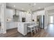 Open kitchen with stainless steel appliances, quartz countertops, and an island at 1524 Groveline Rd, St Cloud, FL 34771