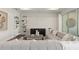 Inviting living area featuring a large sectional, custom shelving, and neutral decor at 1524 Groveline Rd, St Cloud, FL 34771