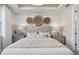 Comfortable main bedroom with a decorative accent wall, soft lighting, and neutral tones at 1524 Groveline Rd, St Cloud, FL 34771