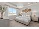 Serene main bedroom with a large window, tray ceiling, and decorative wall accents at 1524 Groveline Rd, St Cloud, FL 34771