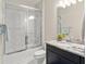Modern bathroom featuring a sleek shower, stylish vanity, and granite countertops at 15420 Southern Martin St, Winter Garden, FL 34787