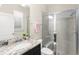 Clean bathroom with a glass-enclosed shower, granite vanity, and contemporary finishes at 15420 Southern Martin St, Winter Garden, FL 34787