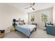 Bright bedroom boasting two windows, a ceiling fan, and a comfortable sleeping area with desk at 15420 Southern Martin St, Winter Garden, FL 34787