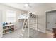 Fun bedroom with a loft bed, ceiling fan, and plenty of storage for a room at 15420 Southern Martin St, Winter Garden, FL 34787