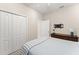 Cozy bedroom offering ample closet space and a mounted TV setup for entertainment at 15420 Southern Martin St, Winter Garden, FL 34787