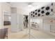 Well-lit bedroom showcases a loft bed, ceiling fan, and a view of the living area at 15420 Southern Martin St, Winter Garden, FL 34787