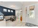 Bright living room with a modern decor, accent wall, neutral walls, and ample natural light at 15420 Southern Martin St, Winter Garden, FL 34787