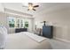 Bright main bedroom with neutral tones, large windows, and plenty of natural light at 15420 Southern Martin St, Winter Garden, FL 34787