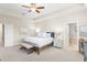 Inviting main bedroom with neutral tones, king bed, and ensuite bathroom at 15420 Southern Martin St, Winter Garden, FL 34787