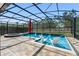 Stunning pool area featuring an in-pool seating area, spa, and waterfall features at 15420 Southern Martin St, Winter Garden, FL 34787