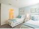 Bright bedroom with two twin beds, and ensuite bathroom at 1575 Plunker Dr, Davenport, FL 33896