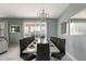 Elegant dining room with stylish chandelier and seating for ten at 1575 Plunker Dr, Davenport, FL 33896