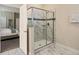 Beautiful bathroom showcasing a modern shower, marble tile, and access to the bedroom at 1575 Plunker Dr, Davenport, FL 33896