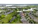 High altitude view of a lakeside community featuring a residential area at 15862 Citrus Grove Loop, Winter Garden, FL 34787