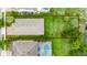 Aerial view of the home, highlighting the spacious backyard and proximity to a scenic pond at 15862 Citrus Grove Loop, Winter Garden, FL 34787