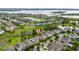 Beautiful aerial view of the property, community and lake, featuring well-maintained landscaping at 15862 Citrus Grove Loop, Winter Garden, FL 34787