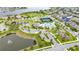 Aerial view of the community center featuring a tennis court, swimming pool, playground and landscaping at 15862 Citrus Grove Loop, Winter Garden, FL 34787