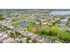 High aerial view of a residential area near a lake, highlighting the neighborhood's layout at 15862 Citrus Grove Loop, Winter Garden, FL 34787