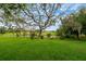 Beautiful backyard featuring a pond and mature trees at 15862 Citrus Grove Loop, Winter Garden, FL 34787