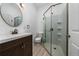 Bathroom with glass enclosed shower, modern vanity, and neutral finishes at 15862 Citrus Grove Loop, Winter Garden, FL 34787