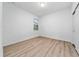 Empty bedroom features wood-look flooring, closet and neutral wall color at 15862 Citrus Grove Loop, Winter Garden, FL 34787
