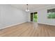 Dining room with a sliding door to backyard and wood-look floors at 15862 Citrus Grove Loop, Winter Garden, FL 34787