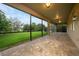 A screened-in patio with brick floor and backyard views at 15862 Citrus Grove Loop, Winter Garden, FL 34787