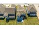 Aerial view of a new home with a swimming pool, large backyard, and manicured lawn at 16103 Silver Brook Way, Winter Garden, FL 34787
