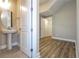 Bathroom features a pedestal sink and tiled flooring at 16103 Silver Brook Way, Winter Garden, FL 34787