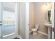 Powder room features tiled floor, pedestal sink and window at 16103 Silver Brook Way, Winter Garden, FL 34787