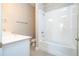 Bathroom featuring a white vanity, toilet, and a shower-tub combination with tiled walls at 16103 Silver Brook Way, Winter Garden, FL 34787