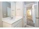 Stylish bathroom with bright vanity, large mirror, and modern sink, complemented by sleek fixtures and design at 16103 Silver Brook Way, Winter Garden, FL 34787