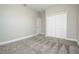 Bright bedroom with plush carpeting, closet, and neutral color palette, creating a serene retreat at 16103 Silver Brook Way, Winter Garden, FL 34787