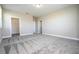 Bright bedroom with walk-in closet featuring neutral walls, plush carpeting, and a recessed ceiling light at 16103 Silver Brook Way, Winter Garden, FL 34787
