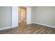 A bright bedroom featuring wood floors and a double-door closet at 16103 Silver Brook Way, Winter Garden, FL 34787