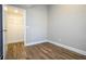 Walk-in closet with wire shelving and wood-look flooring at 16103 Silver Brook Way, Winter Garden, FL 34787
