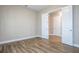 A bright bedroom featuring wood floors and a double-door closet at 16103 Silver Brook Way, Winter Garden, FL 34787