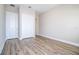 Bedroom with wood-look floors, closet, and neutral paint, offering a serene and comfortable space at 16103 Silver Brook Way, Winter Garden, FL 34787