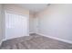 Cozy bedroom featuring plush carpeting, closet, and neutral color palette, creating a serene retreat at 16103 Silver Brook Way, Winter Garden, FL 34787