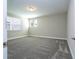 Bedroom featuring neutral carpet, blinds, and baseboards at 16103 Silver Brook Way, Winter Garden, FL 34787