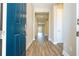 Inviting foyer with wood-look flooring, a blue front door, and neutral paint at 16103 Silver Brook Way, Winter Garden, FL 34787