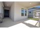 Inviting front porch featuring neutral decor, stone column accents, and ample space for seating at 16103 Silver Brook Way, Winter Garden, FL 34787