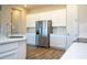 Bright kitchen featuring an island with stainless steel appliances and modern cabinets at 16103 Silver Brook Way, Winter Garden, FL 34787
