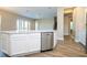 Modern kitchen with white cabinets and stainless steel dishwasher in the island at 16103 Silver Brook Way, Winter Garden, FL 34787