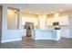 Bright kitchen with white cabinets, an island and stainless steel appliances at 16103 Silver Brook Way, Winter Garden, FL 34787
