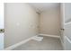 Bright laundry room with washer/dryer hookups and durable tile flooring; ready for modern appliances at 16103 Silver Brook Way, Winter Garden, FL 34787
