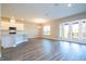 Open-concept living area featuring kitchen, dining and access to the patio at 16103 Silver Brook Way, Winter Garden, FL 34787
