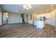 Open-concept living area featuring kitchen, dining and stairs to a second floor at 16103 Silver Brook Way, Winter Garden, FL 34787