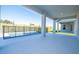 Covered patio featuring backyard views and a home exterior highlighting seamless indoor-outdoor living at 16103 Silver Brook Way, Winter Garden, FL 34787