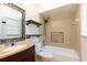 Bathroom with custom tile details, granite vanity, and shower and tub combination at 18 Palmira Rd, Debary, FL 32713